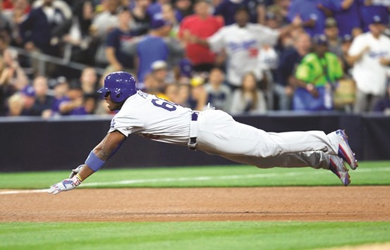 Los Angeles Dodgersu2019 Yasiel Puig dives into third base for a two-RBI triple during the fourth inning at Petco Park in San Diego. PICTURE: San Diego Union-Tribune/TNS)