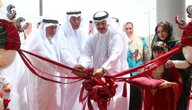 Sheikh Abdullah bin Ali bin Jabor al-Thani and Hussain Alfardan formally reopening Commercial Bank's u2018Al Wakrah Avenueu2019 branch on Wednesday. PICTURES: Jayan Orma