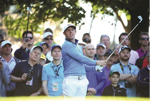 Rory McIlroy of Northern Ireland plays his shot from the fourth tee during a practice round prior to the start of the 2016 Masters Tournament at Augusta National Golf Club.