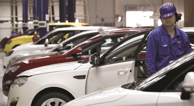 An employee works in an assembly line at an automobile factory of SAIC Motor in Shanghai. Chinau2019s top carmakers SAIC and Great Wall are in separate talks with the state government of Maharashtra in western India to set up a factory in the auto hub of Pune city, the state industries minister told Reuters yesterday.