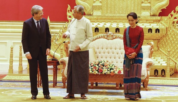 Italian Foreign Minister Paolo Gentiloni (left), Myanmar President Htin Kyaw (centre) and Myanmaru2019s Foreign Minister Aung San Suu Kyi attend a meeting at the presidentu2019s house in Naypyidaw yesterday.