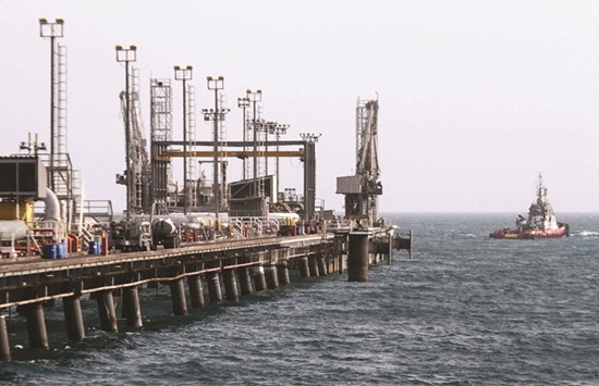 A picture shows an oil facility in the Khark Island on the shore of the Gulf (file). Iran has rejected freezing its output at January levels, which Opec secondary sources have estimated to be 2.93mn bpd, and wants to return to much higher pre-sanctions production.