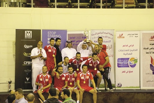 CHAMPIONS: Ezdan Holding team with their winnersu2019 trophy.