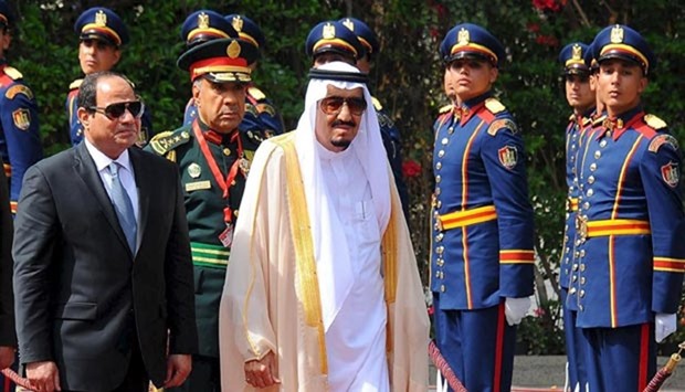Egyptian President Abdel Fattah al-Sisi and King Salman of Saudi Arabia walk during the reception ceremony in the Egyptian Presidential Palace in Cairo on Thursday.