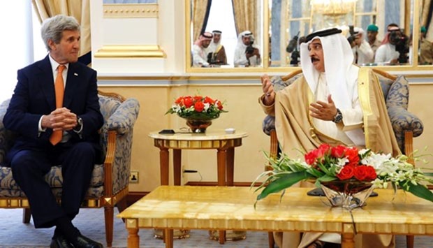 US Secretary of State John Kerry listens to welcoming remarks from Bahrain's King Hamad bin Issa al-Khalifa at Gudaibiya Palace on Thursday.