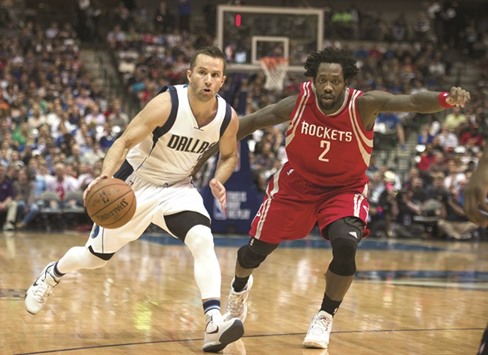 Houston Rockets guard Patrick Beverley (right) guards Dallas Mavericks guard JJ Barea during their NBA game in Dallas, Texas, on Wednesday. (USA TODAY Sports)