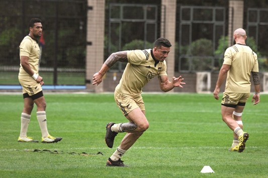 New Zealand Sevens player Sonny Bill Williams (centre) runs sprints during a rugby sevens training session in Hong Kong, ahead of the Hong Kong Rugby Sevens, starting today. (AFP)