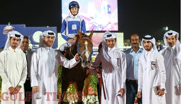 Trainer Jassim Ghazali and owner Khalifa bin Sheail al-Kuwari lead in Spaghetti, jockey Harry Bentley astride, after four-year-old colt won the Qatar Silver Sword for Pure Arabians yesterday.
