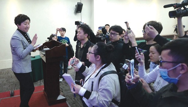 Yitel hotel manager Liu Hongni talks to journalists during a press conference in Beijing.