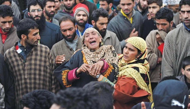 Mourners react during the funeral for suspected militant Wasim Malla in Pehlipora village in Shopian district yesterday.
