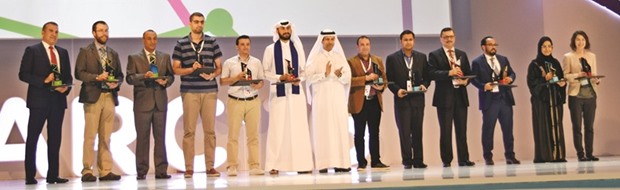 Dr Samer Adham (left) and other winners with officials.