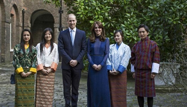 Britain's Prince William and his wife Catherine, Duchess of Cambridge, attend a reception for young people from India and Bhutan, at Kensington Palace in London on Wednesday.