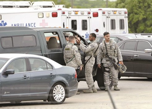 Military personnel are seen inside Lackland Air Force Base in San Antonio, Texas, yesterday.