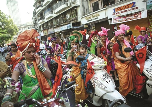 Maharashtrians dressed in traditional costumes attend celebrations to mark the Gudi Padwa festival in Mumbai yesterday.