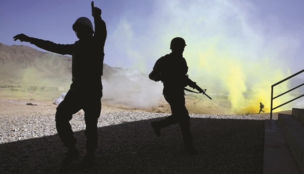 Afghan National Army (ANA) officers participate in a training exercise at the Kabul Military Training Centre in Kabul.