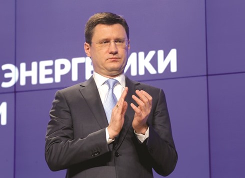 Russian Energy Minister Alexander Novak applauds during a session of the ministryu2019s board in Moscow yesterday. Novak said yesterday he expects leading oil producers will agree to freeze output at a meeting in Doha on April 17, which should help the global oil market to rebalance.
