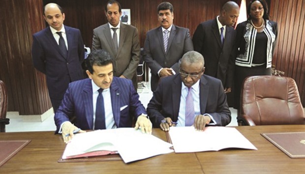 HE Dr Ali bin Fetais al-Marri and Sidiki Kaba signing an agreement in Dakar.