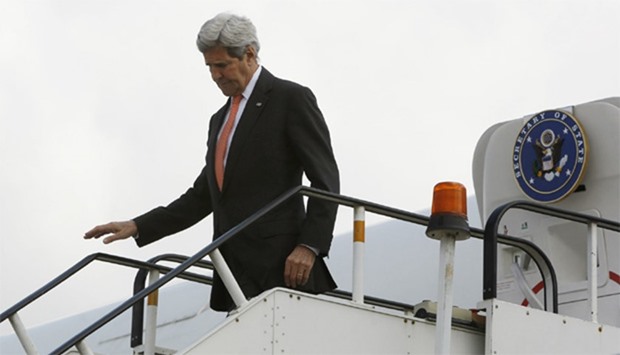 US Secretary of State John Kerry disembarks from his aircraft after arriving at Kabul International 