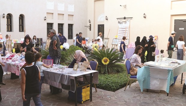 Visitors and regular patrons of QatArtu2019s handmade market at Katara.