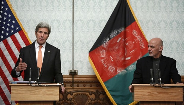 US Secretary of State John Kerry (L) and Afghanistan's President Ashraf Ghani take part in a press conference at Dilkusha Palace in Kabul