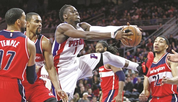 Pistons' Reggie Jackson (second from right) gets control of the ball against the Washington Wizards during their game in Auburn Hills, Michigan, on Friday. (USA TODAY Sports)