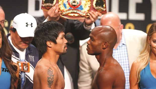 Manny Pacquiao (left) faces off against Timothy Bradley Jr during weigh ins prior to their boxing match at MGM Grand Garden Arena. PICTURE: USA TODAY Sports