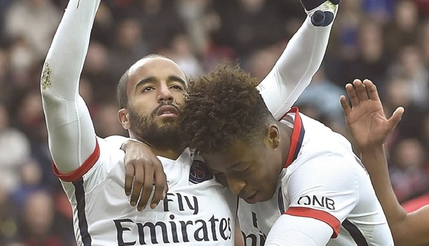 Paris Saint-Germainu2019s midfielder Lucas (left) celebrates after scoring a penalty kick during the French Ligue 1 match against Guingamp at the Roudourou stadium in Guingamp, western France. (AFP)