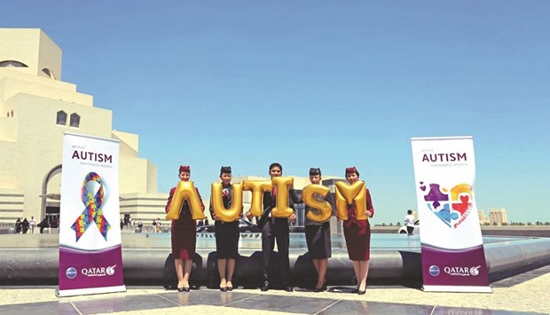 Qatar Airways cabin crew taking part in the autism awareness month.