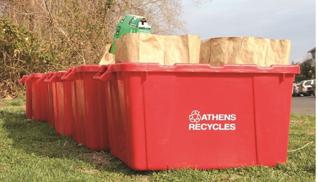 City recycling bins await pickup near South Shafer Street in Athens.