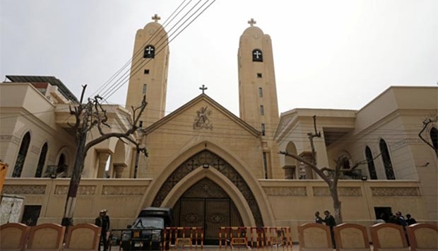 Security forces stand outside the Coptic church that was bombed in Tanta, Egypt, on Monday.