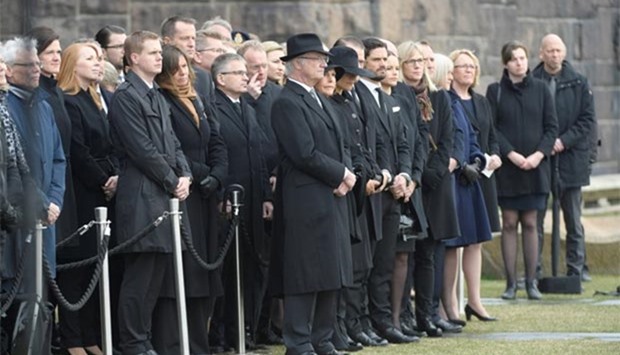 King Carl XVI Gustaf, members of the royal family and others gather for the official ceremony on Monday to remember the victims of the terror attack on Drottninggatan, Stockholm.