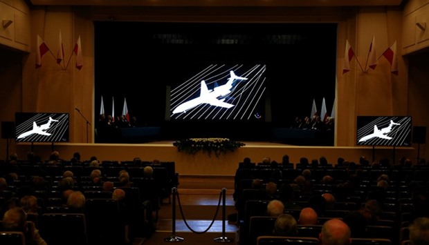 A movie is projected during a new Polish government commission statement on the seventh anniversary of the crash of the Polish government plane in Smolensk, Russia, that killed 96 people on board including late President Lech Kaczynski and his wife Maria, in Warsaw, Poland.