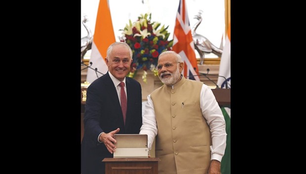 Prime Minister Narendra Modi and his Australian counterpart Malcolm Turnbull open the TERI Deakin Nanobio technology centre at the start of a joint press briefing in New Delhi yesterday.