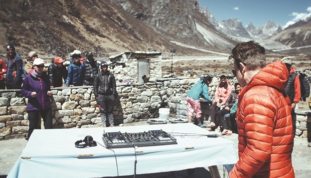 This handout picture released by DJ Paul Oakenfoldu2019s SoundTrek yesterday shows the British artist performing a practice set at Pheriche village on his way to Mount Everestu2019s base camp ahead of a concert billed as the u201chighest party on earthu201d.