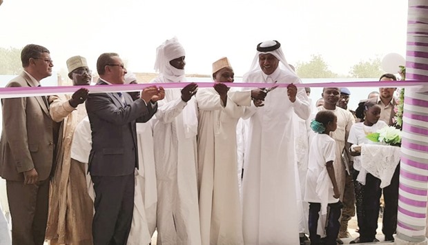 Hamad bin Abdul Hadi al-Hajri and other dignitaries lead the ribbon-cutting ceremony at the  Uthman ibn Affan health centre in Chad.