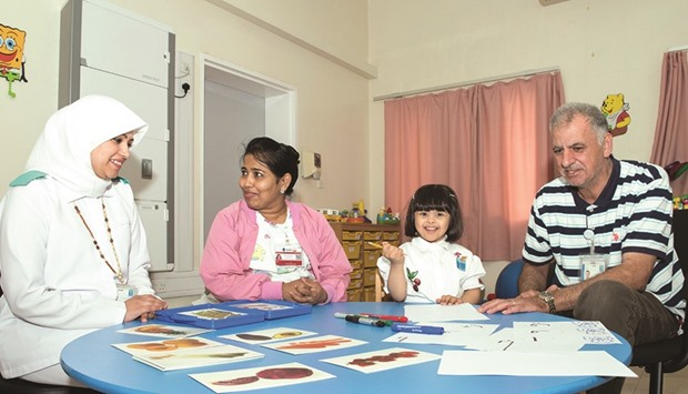 Haya al-Noaimi with specialists from Child Development Center.