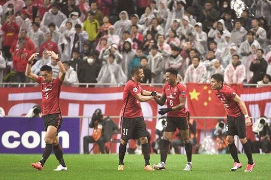 Urawa Red Diamonds Rafael Da Silva (second right) celebrates with teammates after scoring a goal during the AFC Champions League match against Chinau2019s Shanghai SIPG in Saitama, Japan yesterday. (AFP)