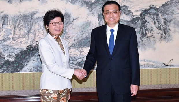 Hong Kong chief executive-elect, Carrie Lam (left), shaking hands with Chinese Premier Li Keqiang in Beijing.