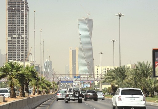 Saudi commuters drive down a main street in the capital Riyadh. The country plans to raise between $10bn and $15bn from international bond markets this year and sell about 70bn riyals ($19bn) locally.