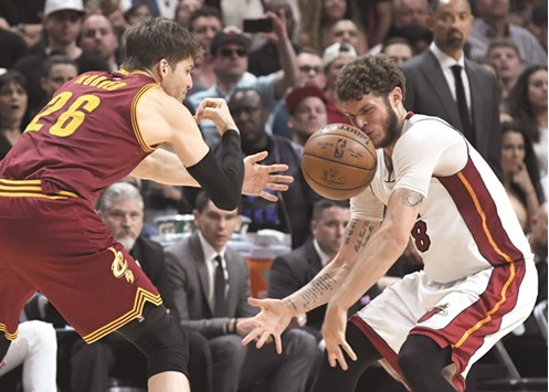 Miami Heat guard Tyler Johnson (R) is hit in the face on a loose ball by Cleveland Cavaliers guard Kyle Korver during the second half at American Airlines Arena. The Heat won 124-121 in overtime. PICTURE: USA TODAY Sports
