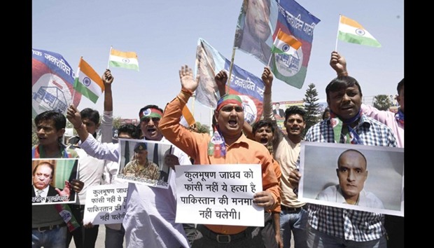 Activists of the Lok Janshakti Party stage a demonstration in front of Pakistan High Commission against the capital punishment to former Indian Navy officer Kulbhushan Jadhav, in New Delhi yesterday.