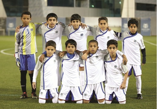 Aspire Academyu2019s U-12 players pose for a team photo ahead of their match.