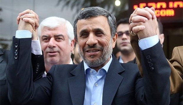 Mahmoud Ahmadinejad reacts as he submits his name for registration as a candidate in Iran's presidential election, in Tehran on Wednesday.