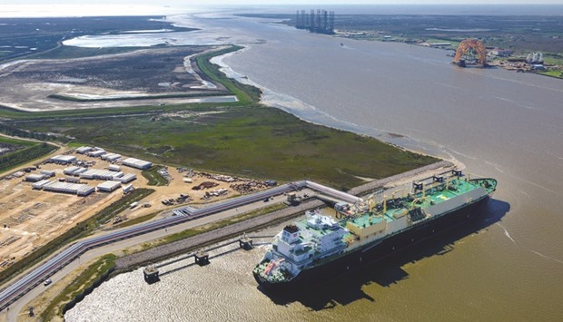 An LNG carrier is docked at the Cheniere Energy terminal in this aerial photograph taken over Sabine Pass, Texas, US on February 24, 2016. Cheniereu2019s potential new customers including Pakistan, Bangladesh and Bahrain would add to the 18 nations that have so far received gas supplies from Cheniereu2019s Sabine Pass terminal.
