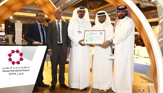 Al-Meer (second right) with other HIA officials with the Level 3 of ACI Airport Carbon Accreditation obtained by Qataru2019s world-scale airport.