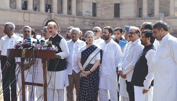 Congress leader Ghulam Nabi Azad talks to press after meeting President Pranab Mukherjee yesterday. Also seen are Sonia Gandhi, Rahul Gandhi, D Raja, Sitaram Yechury and Anand Sharma among others.