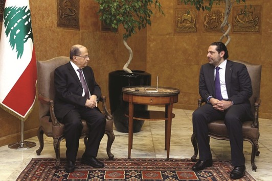 Lebanonu2019s President Michel Aoun meets with Prime Minister Saad al-Hariri at the Presidential Palace in Baabda, yesterday.