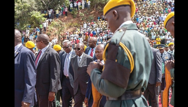 Zimbabweu2019s President Robert Mugabe arrives for the burial of Brigadier General James Murozvi, who was granted national hero status, at the National Heroes Acre in Harare yesterday.