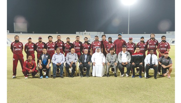 Qatar Cricket Association president Yousef al-Kuwari and other officials pose with the Qatar national team.