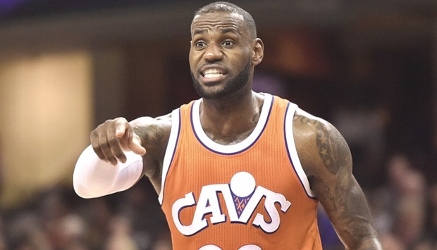 Cleveland Cavaliers forward LeBron James gives instructions to a teammate during the first half against the Philadelphia 76ers.